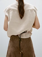 Veste sans manches plastron boutonné