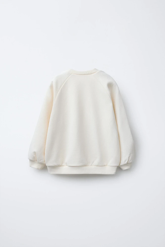 SWEAT ROMANTIQUE À LACETS