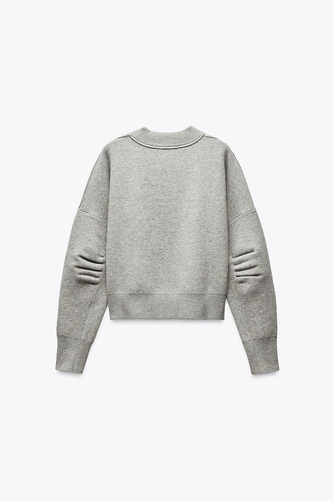 PLEATED SLEEVE SWEATSHIRT