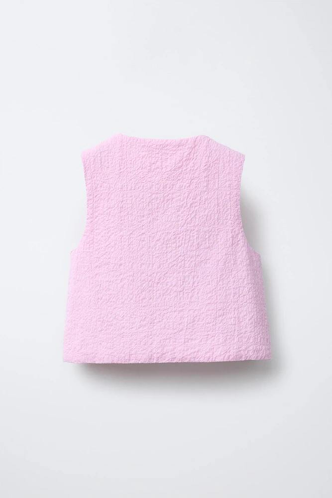 TEXTURED VEST WITH HEART POCKETS