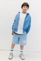 RAISED TEXT PLUSH SHORTS
