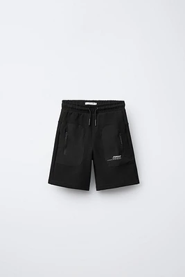 BERMUDA SPORT EN MATIÈRES VARIÉES