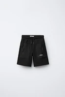 BERMUDA SPORT EN MATIÈRES VARIÉES