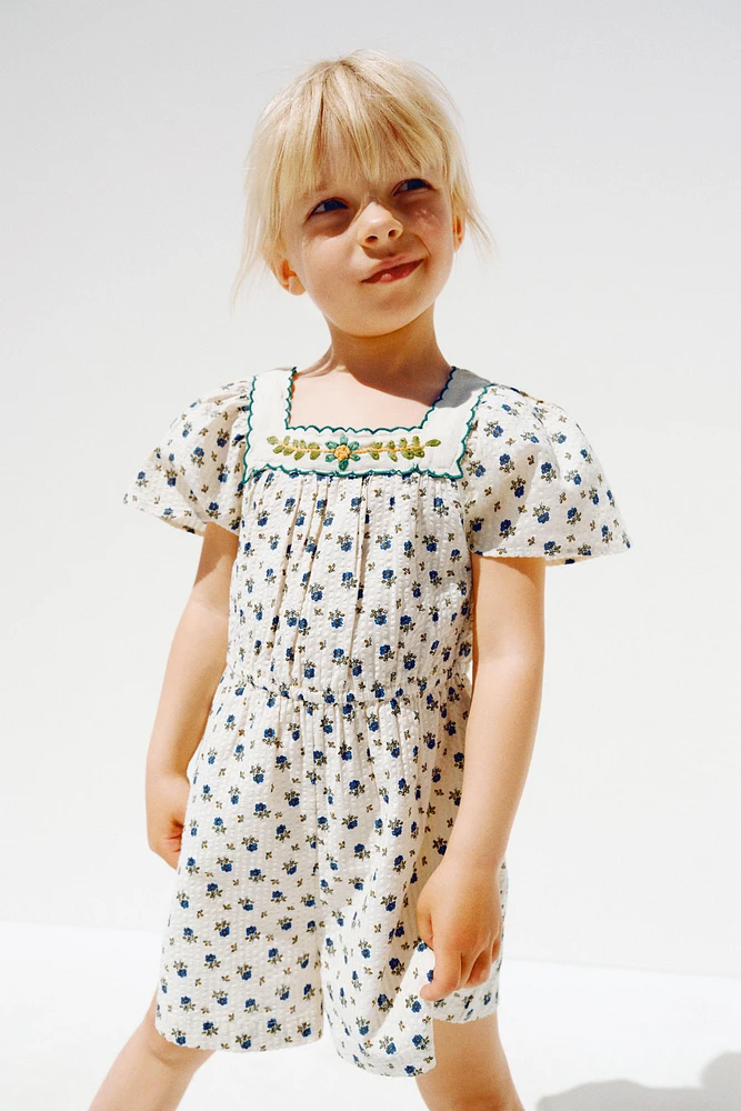 TEXTURED FLORAL SHORT JUMPSUIT