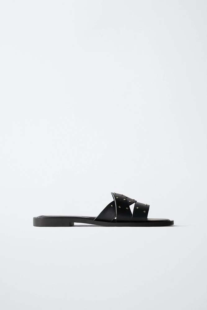 STUDDED CROSSOVER FLAT SANDALS