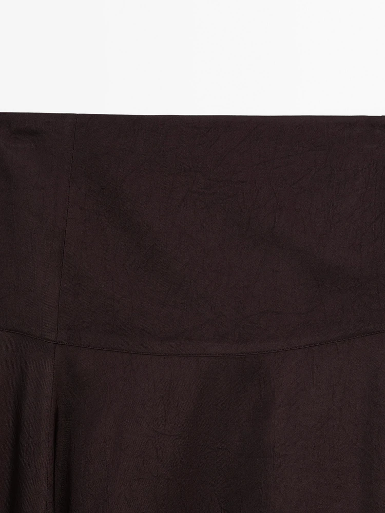 Jupe midi satinée avec empiècement
