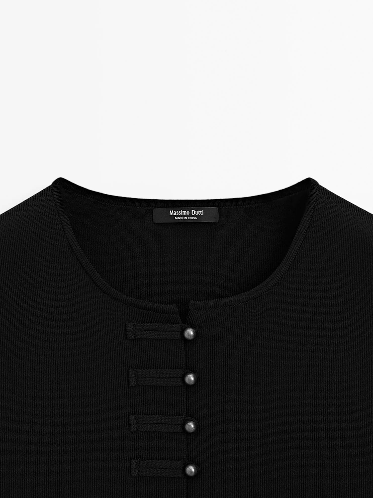 Veste sans manches en maille boutons fantaisie