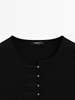 Veste sans manches en maille boutons fantaisie