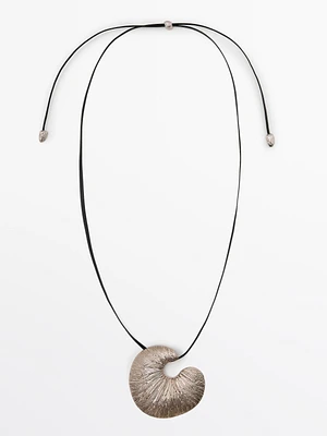 Necklace with fossil piece pendant
