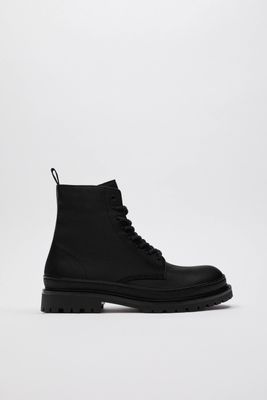 THICK SOLED LACED LEATHER BOOTS