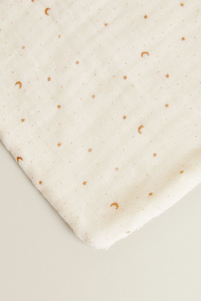 DOUBLE-SIDED TOWEL WITH MOONS AND STARS