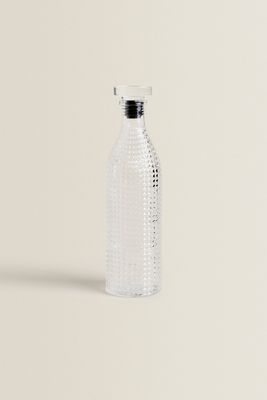 GLASS BOTTLE WITH RELIEF DESIGN