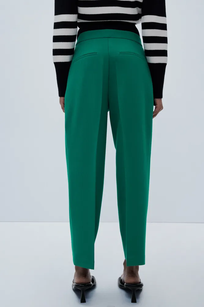 CROSSOVER PLEATED PANTS
