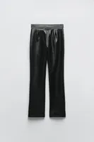 ZIPPERED FAUX LEATHER PANTS