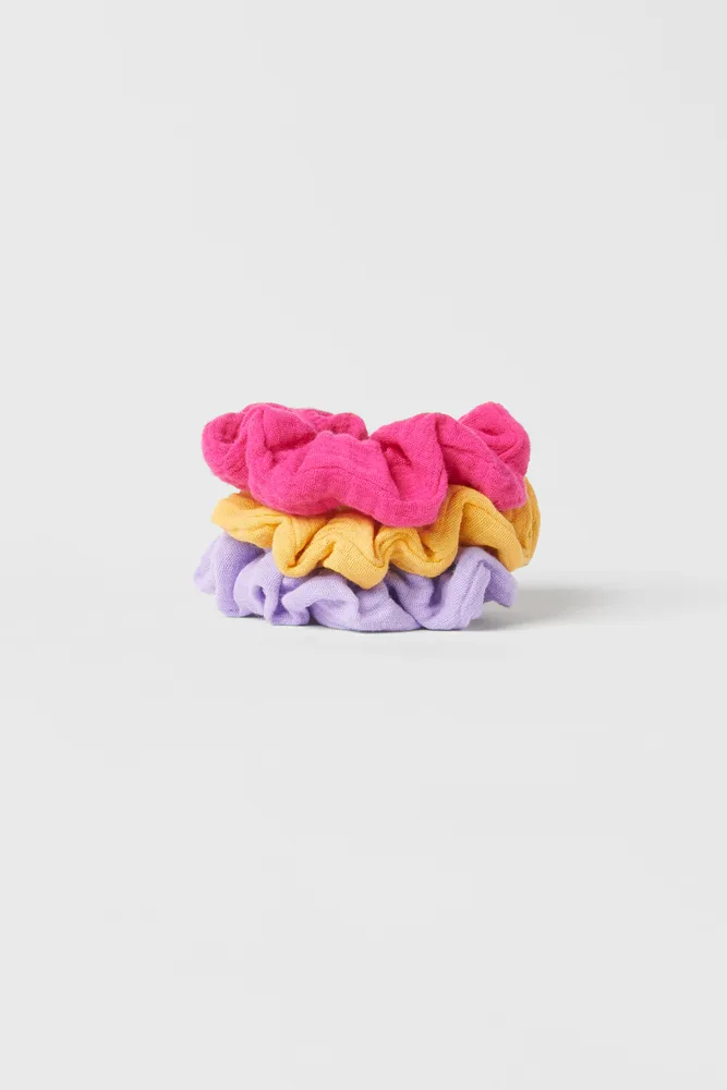THREE-PACK OF SMOOTH TEXTURED COLORFUL HAIR TIES
