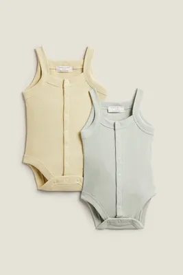SOLID COLOR BODYSUITS WITH STRAPS (PACK OF 2)