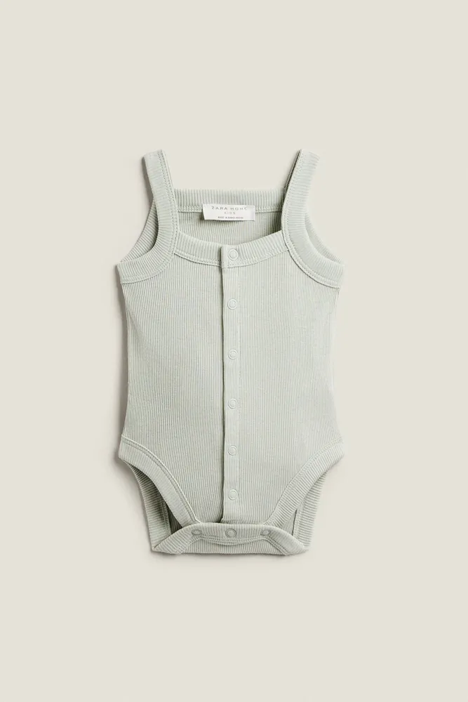 SOLID COLOR BODYSUITS WITH STRAPS (PACK OF 2)