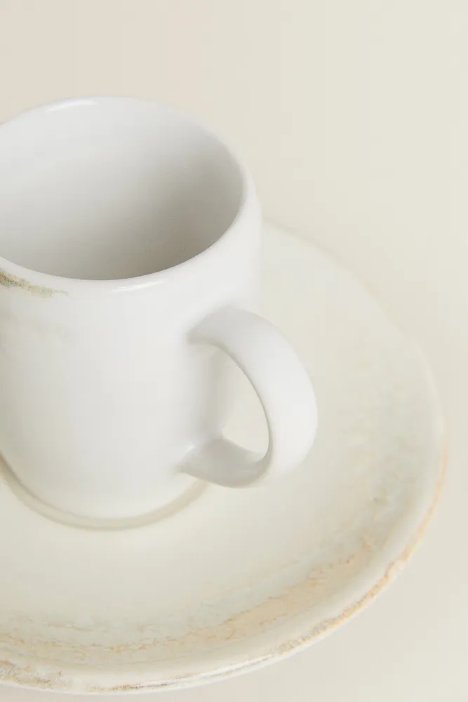 STONEWARE COFFEE CUP AND SAUCER