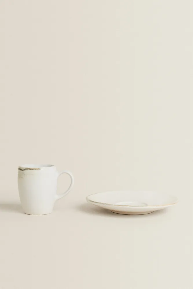 STONEWARE COFFEE CUP AND SAUCER
