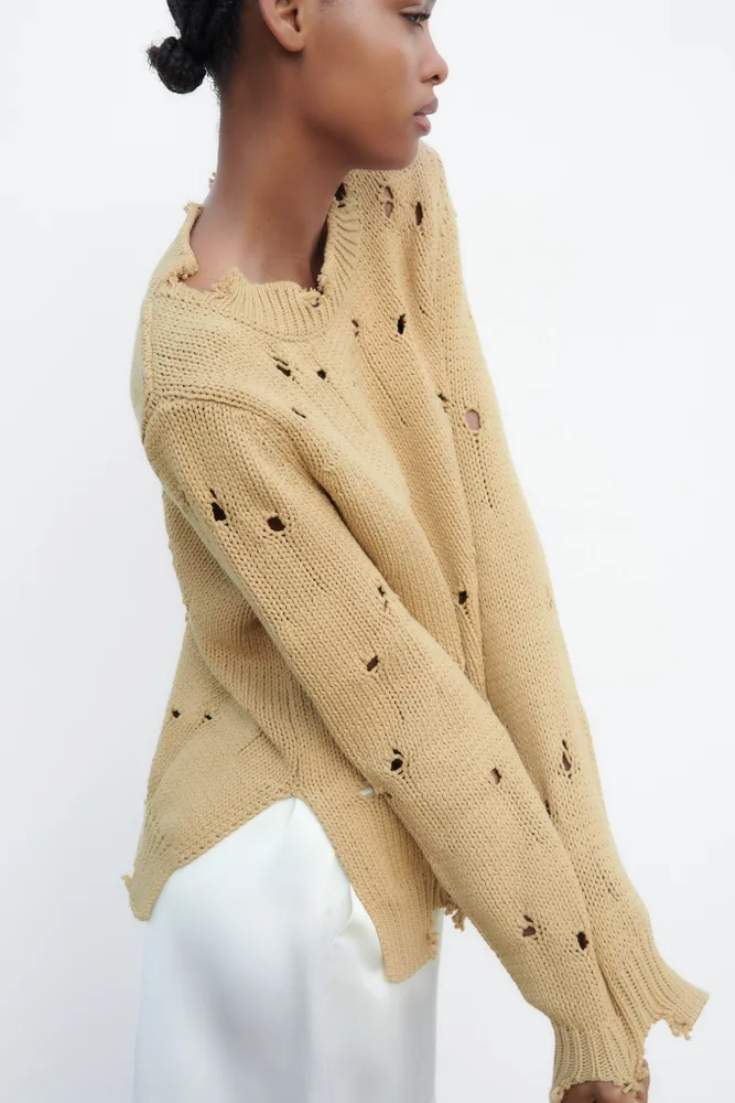 KNIT SWEATER WITH RIPS