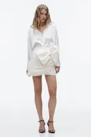 MINI JUPE-SHORT À NŒUD