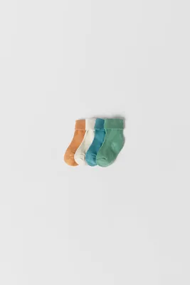 BÉBÉ / LOT DE QUATRE PAIRES CHAUSSETTES