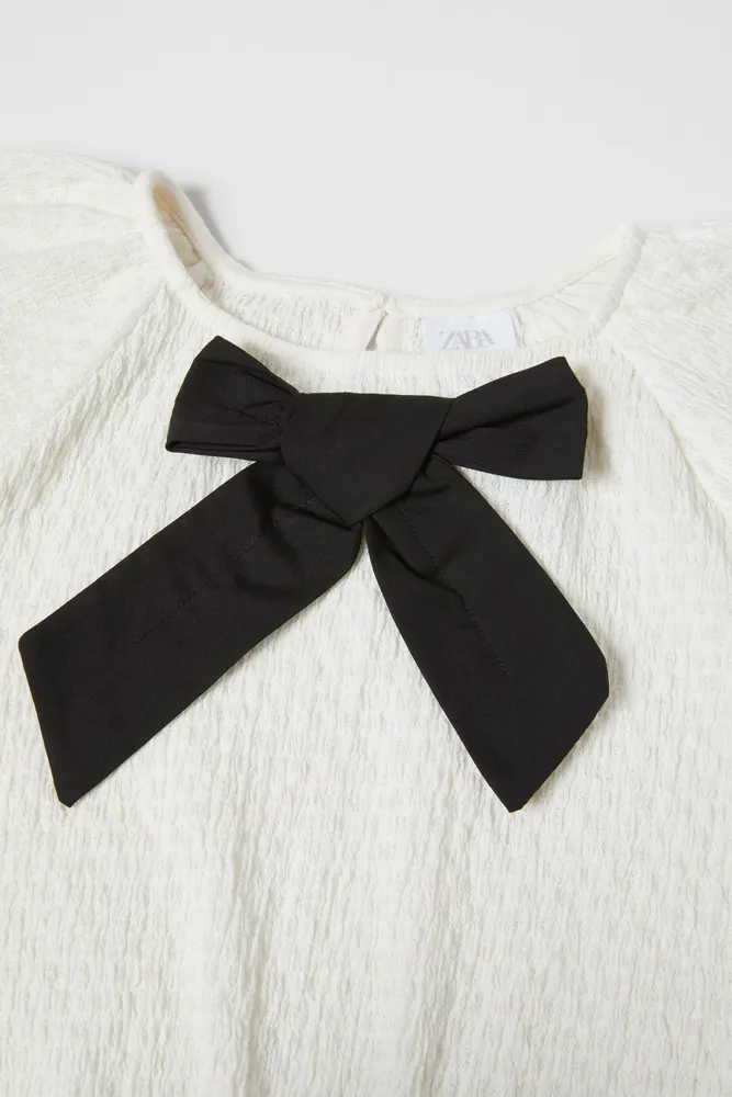 CONTRAST BOW TEXTURED BLOUSE