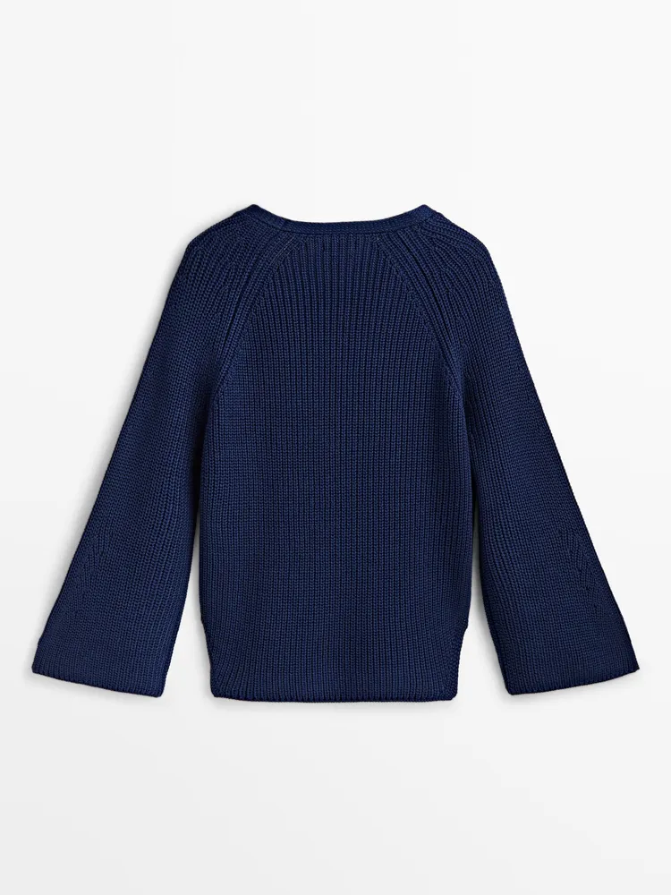 Knit sweater with flared sleeves