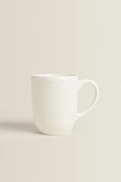 EARTHENWARE MUG WITH A RAISED-DESIGN EDGE