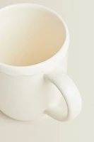 EARTHENWARE MUG WITH A RAISED-DESIGN EDGE