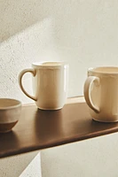 EARTHENWARE MUG WITH A RAISED-DESIGN EDGE