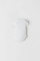 THREE-PACK OF SHORT SLEEVE SURPLICE BODYSUITS