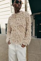 FRINGED KNIT SWEATER