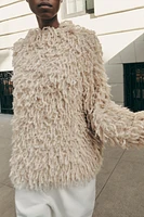 FRINGED KNIT SWEATER