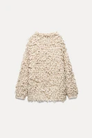 FRINGED KNIT SWEATER