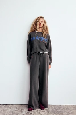 WASHED EFFECT TEXT SWEATSHIRT