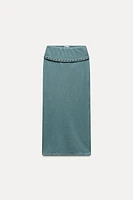 MIDI SKIRT WITH METAL EYELETS