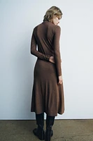 Midi turtleneck dress with long sleeves. A-line silhouette.