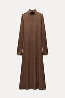 Midi turtleneck dress with long sleeves. A-line silhouette.