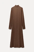 Midi turtleneck dress with long sleeves. A-line silhouette.