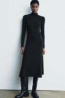 Midi turtleneck dress with long sleeves. A-line silhouette.