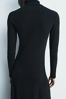 Midi turtleneck dress with long sleeves. A-line silhouette.