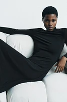 Midi turtleneck dress with long sleeves. A-line silhouette.