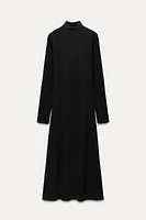 Midi turtleneck dress with long sleeves. A-line silhouette.