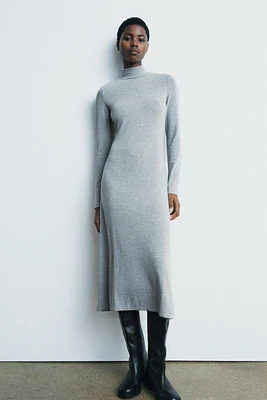 Midi turtleneck dress with long sleeves. A-line silhouette.