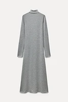 Midi turtleneck dress with long sleeves. A-line silhouette.