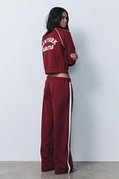 SIDE STRIPE TEXT PLUSH PANTS