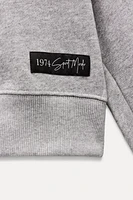 OVERSIZED LABEL PLUSH SWEATSHIRT