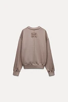 CROPPED LABEL SWEATSHIRT