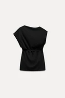 ASYMMETRIC NECKLINE BELTED TOP